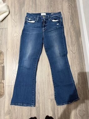 Frame Denim Blue Flare Jeans with Subtle Distress